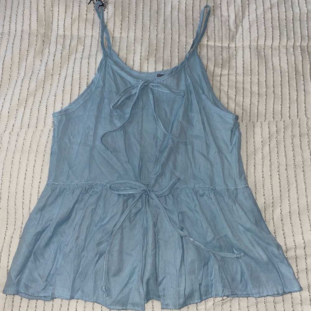Never worn open back light blue tank top